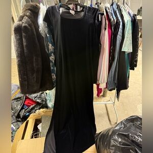 Black velvet sheath dress with small slit